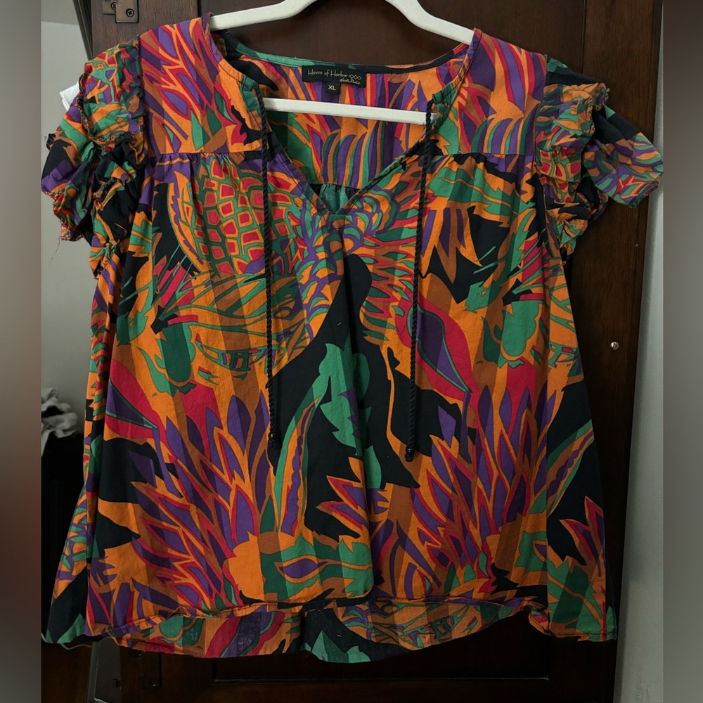 Beautiful 100% cotton top with ruffled sleeves.